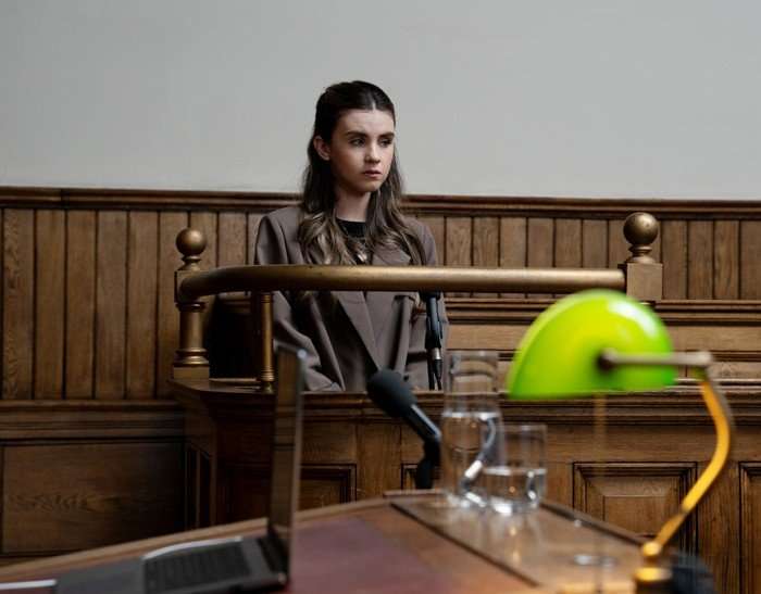 April stands in court in a scene from Emmerdale