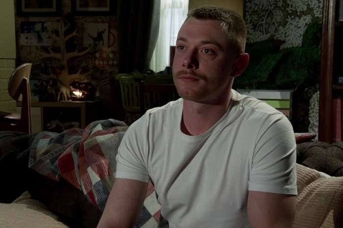 Daniel looks distant and upset in a scene from Coronation Street
