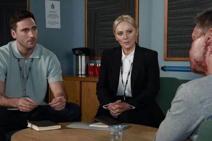 Kit and Lisa sat in a police interview room in Coronation Street