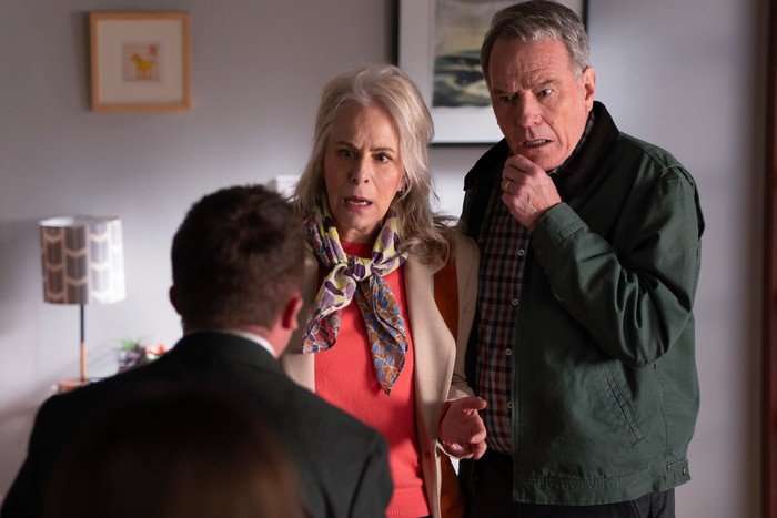 Jane Kaczmarek and Bryan Cranston in Malcolm in the Middle: Life's Still Unfair. They are looking at Malcolm who is stood in front of him, shocked.