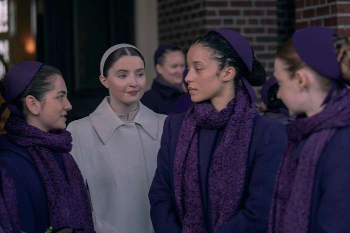 THE TESTAMENTS - &ldquo;Daisy&rdquo; - An incident on a school trip spurs Daisy&rsquo;s memories of Toronto, revealing her past and a world shattered by violence. (Disney/Russ Martin) Mattea Conforti, Lucy Halliday and Chase Infiniti star in The Testaments; their characters are stood outside a brick building, wearing neat uniforms and talking with one another