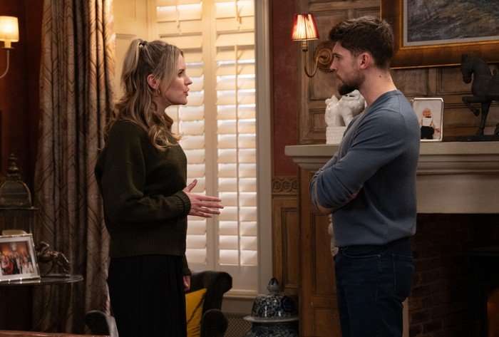 Dawn and Joe stood talking in Home Farm in a scene from Emmerdale