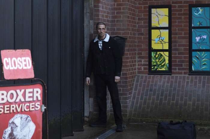 Carl Webster stands alone beside the Websters' Autocentre in Coronation Street