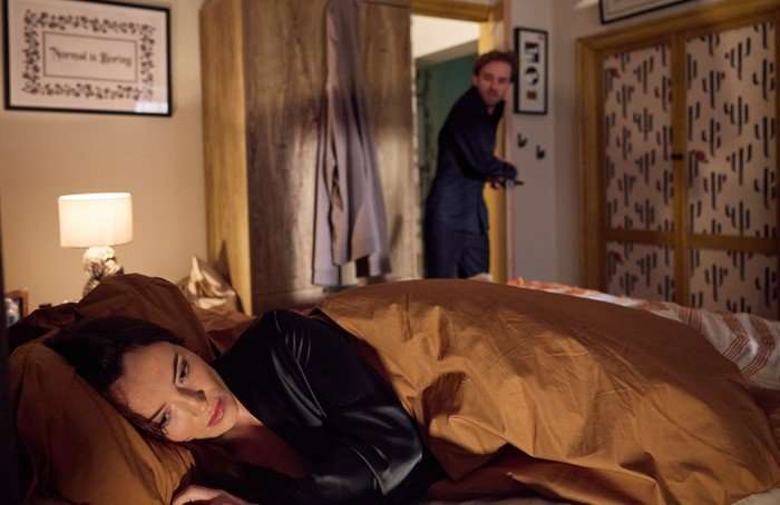 Jodie lies awake in bed, as David creeps in through the door in Coronation Street