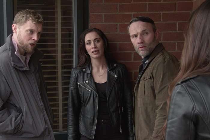 Shona is surrounded by two henchmen in a scene from Coronation Street