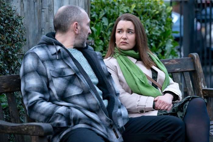 Ross and Vicki sitting on the bench dedicated to her grandfather Arthur Fowler in EastEnders