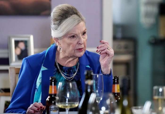 Ann Mitchell as Cora Cross sat at the Beale house table in EastEnders.