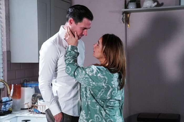 Vicki holds her hand on Zack's face in a scene from EastEnders