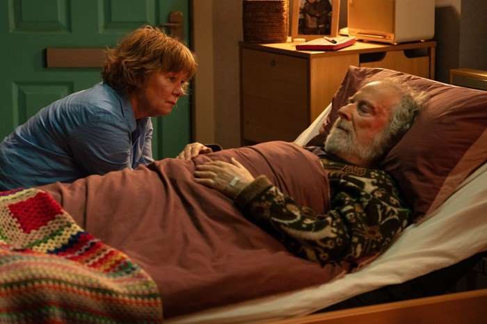 Nigel Bates in bed with Julie by his side in EastEnders.