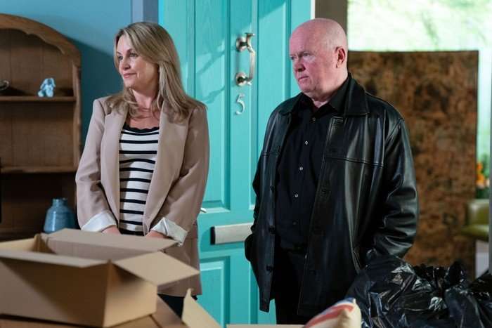 Sam and Phil stood in Nigel's care home in a scene from EastEnders