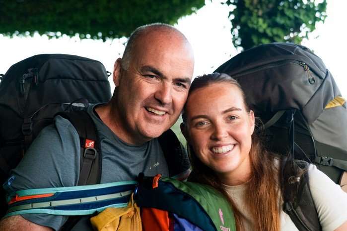 Andrew and Molly stood next to each other smiling ahead.