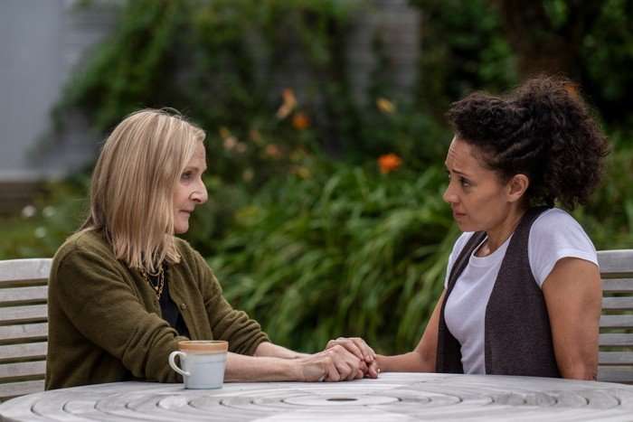 Lesley Sharp and Camilla Beeput in Bergerac, sat outside at a table, having a conversation.