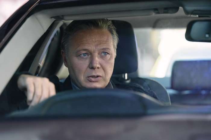 Shaun Dooley in Criminal Record, sat in a car, driving.