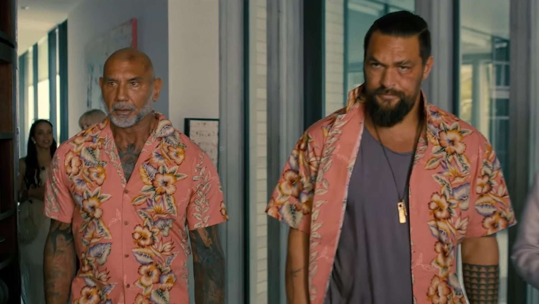 Dave Bautista and Jason Momoa wearing flowered shirts in The Wrecking Crew.