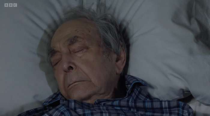 Leonard Fenton as Dr Harold Legg lying dead in EastEnders.