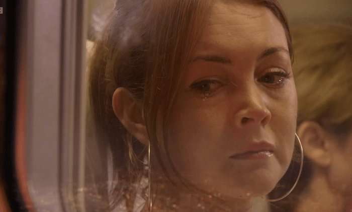 Stacey Slater looking out of an airplane window in EastEnders.