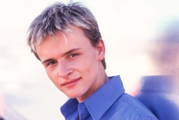 A young Jon Lee from S Club, wearing a light blue shirt.