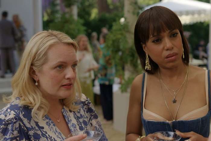 Elisabeth Moss and Kerry Washington in Imperfect Women, stood next to each other outside, speaking to someone off screen.