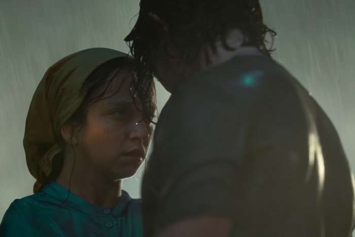 Molly Windsor and Fra Fee in Unchosen, stood in the rain together.
