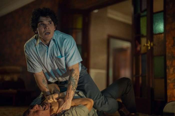 Fra Fee stars in Unchosen; in this scene, Sam is standing over Mr Phillips, grabbing him by the neck and looking out in shock at someone witnessing it