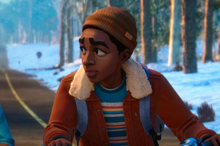 Elisha 'EJ' Williams as Lucas Sinclair in Stranger Things: Tales From '85, riding a bike along a snowy road and looking to the side.