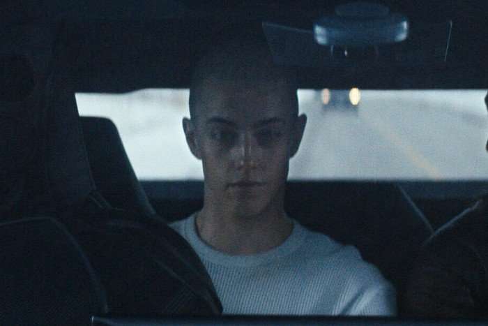 Ess H&ouml;dlmoser as Cindy in The Boys, sat in the back of a car.