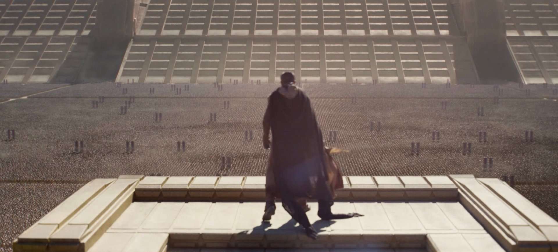 Timothée Chalamet standing in front of a crowd in the film, Dune: Part Three.