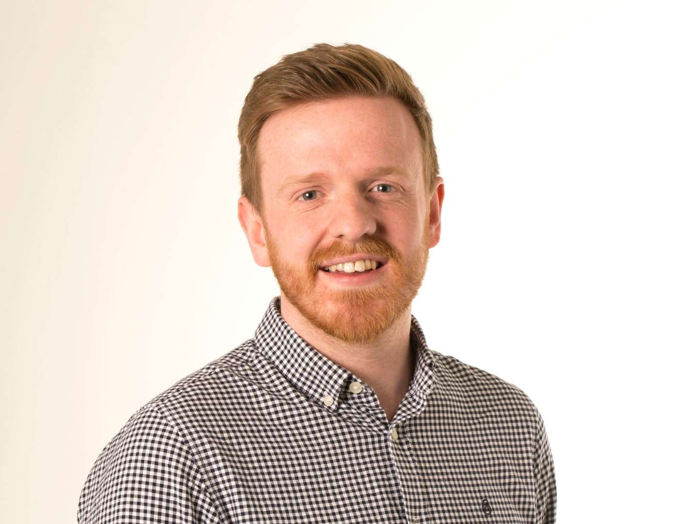 Radio Times sports editor Michael Potts. He has a beard, is looking at the camera and smiling