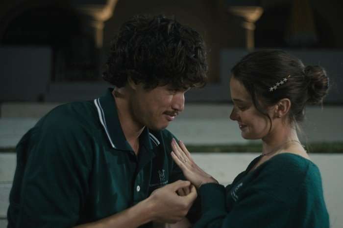 Austin and Ashley fondly embrace, as they admire the latter's engagement ring