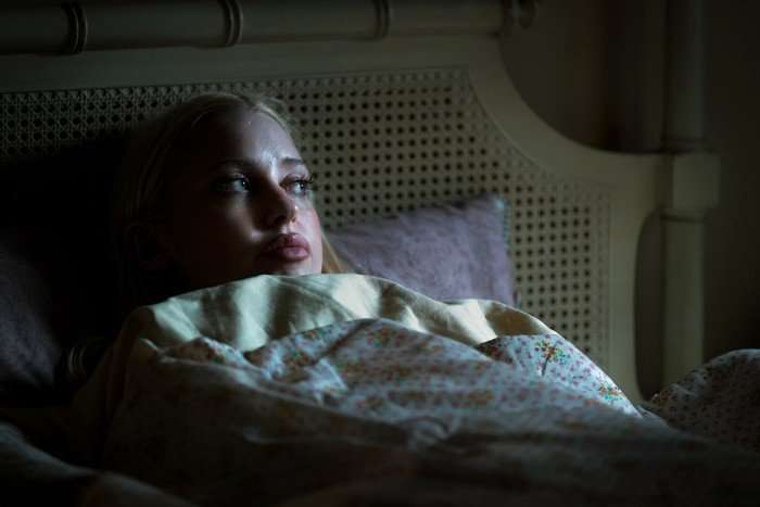 Chloe Cherry lies in bed as Faye Valentine in Euphoria season 3.