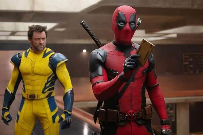 Hugh Jackman and Ryan Reynolds in Deadpool and Wolverine in their super suits looking confused
