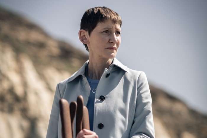 Laura Elphinstone as DS Bella Moy in Grace in a grey coat