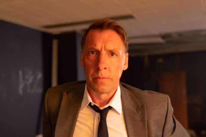 A close-up shot of Craig Parkinson as DS Norman Potting in Grace