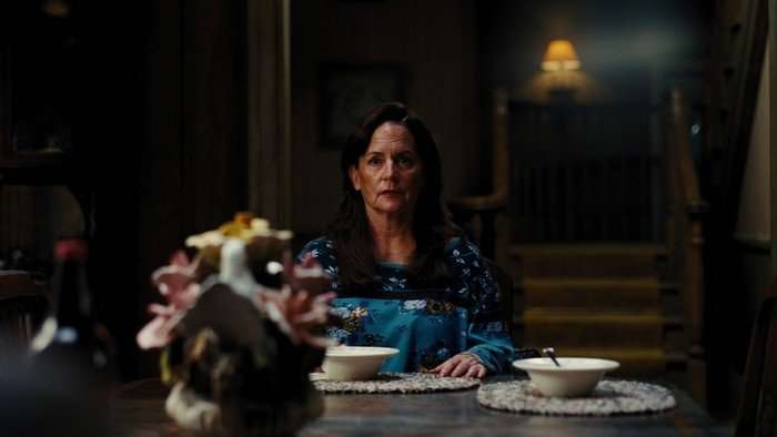 Martha Kelly seated as Laurie in Euphoria season 3.