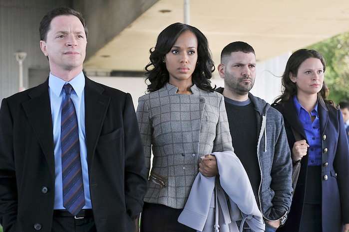Joshua Malina, Kerry Washington, Guillermo Diaz and Katie Lowes in Scandal standing outside and looking serious as they confront someone.
