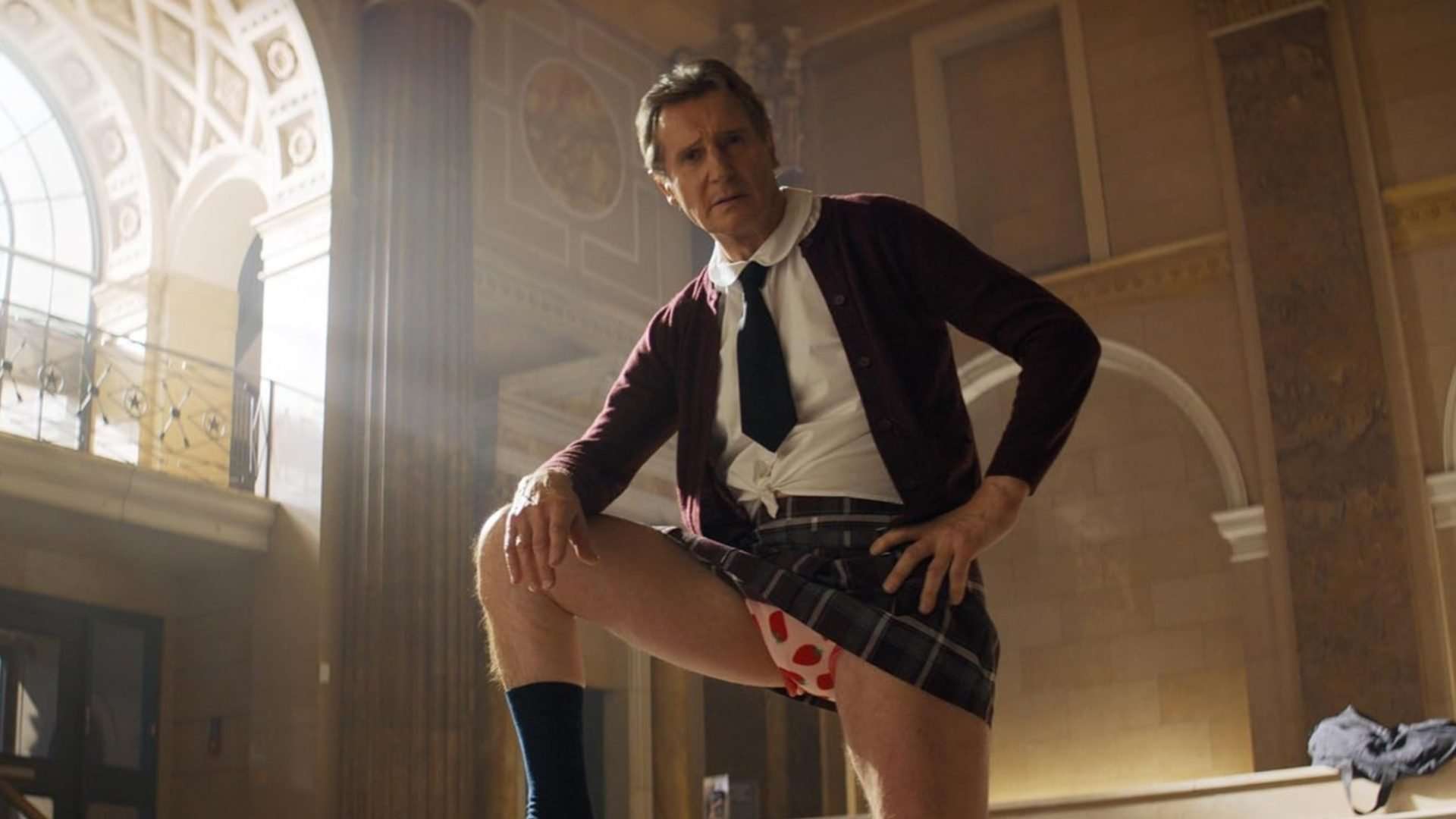 Liam Neeson stands with his underwear showing in The Naked Gun.