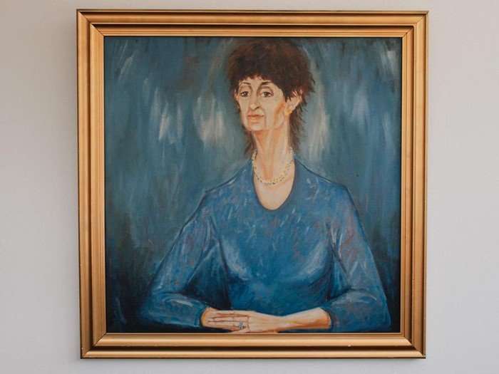 Painting of Mrs Mangel from Neighbours, a mostly blue composition in a golden frame.