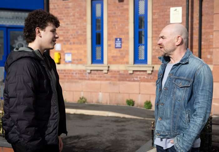 Tim and Will chatting outside of the police station in Coronation Street
