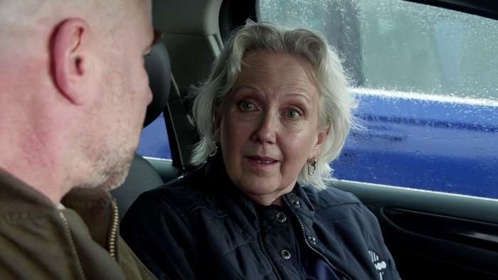 Trisha looks shocked in a car with Tim