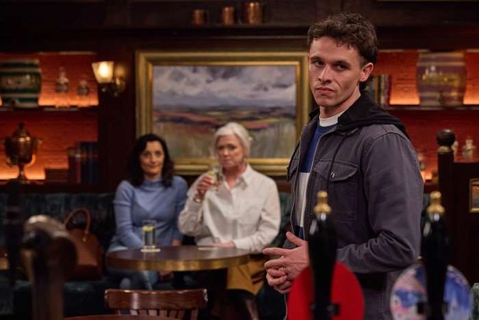 Manpreet and Dr Todd stare over towards Jacob in Emmerdale
