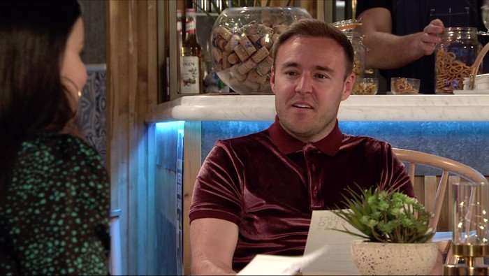 Tyrone sat in the bistro in Coronation Street