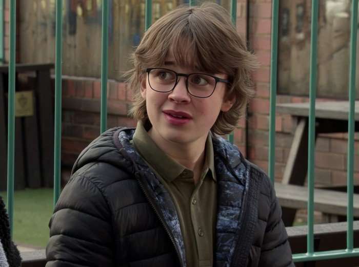 Sam Blakeman in the park in a scene from Coronation Street