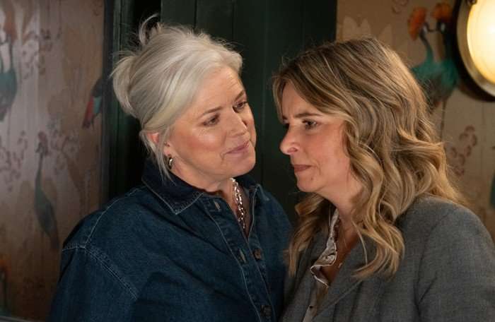 Dr Todd lurks in Charity's face in a scene from Emmerdale