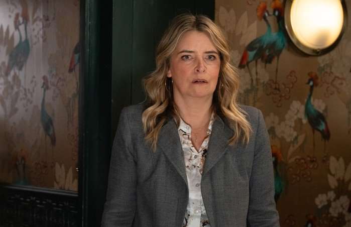 Charity looks stunned in a scene from Emmerdale
