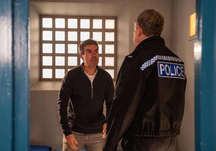 PC Swirling talks to Cain in a scene from Emmerdale