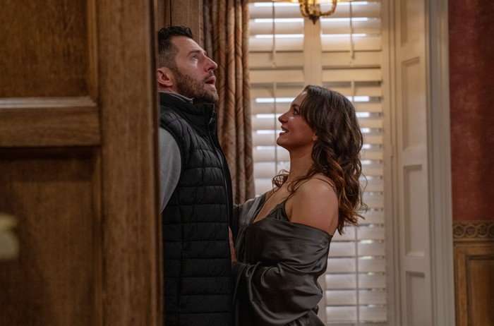 Gabby throws herself onto Ross in a scene from Emmerdale