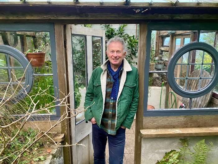 Toby Buckland stood in a doorway, smiling ahead.