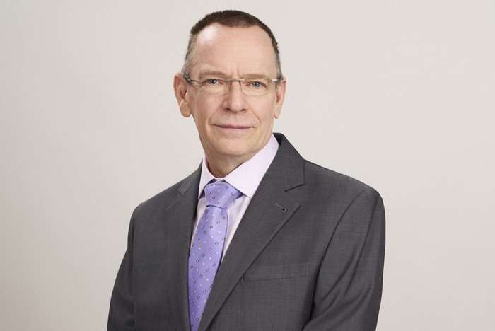 Adam Woodyatt poses in a suit as Ian Beale for EastEnders.