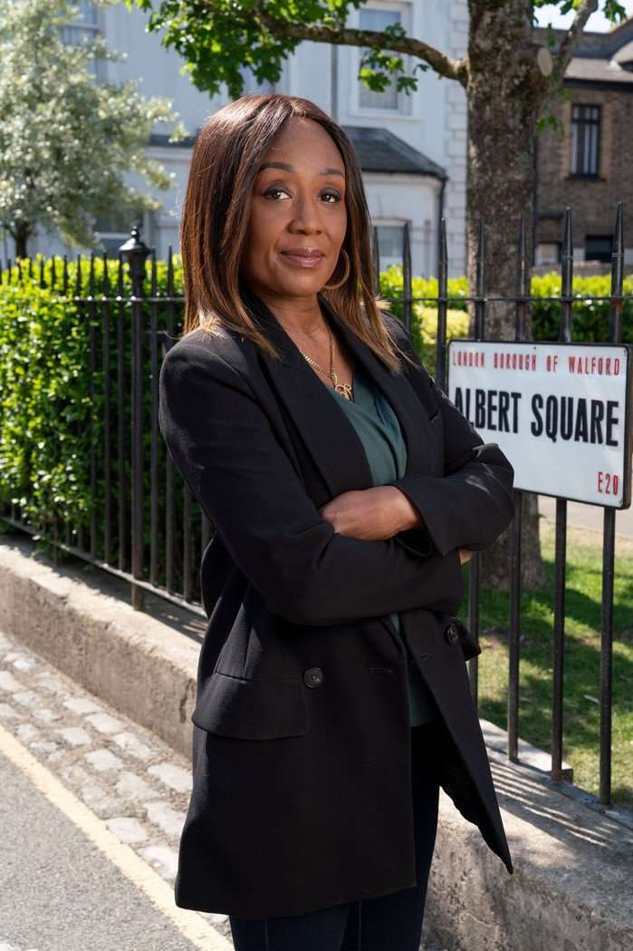 527191,TITLE:Eastenders Diane Parish poses as Denise Fox in the Albert Square gardens for EastEnders.