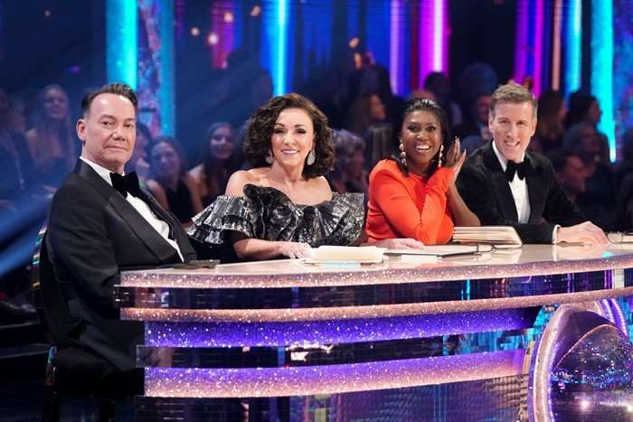 Craig Revel Horwood, Shirley Ballas, Motsi Mabuse and Anton Du Beke sat down at the judges table, smiling to one side.